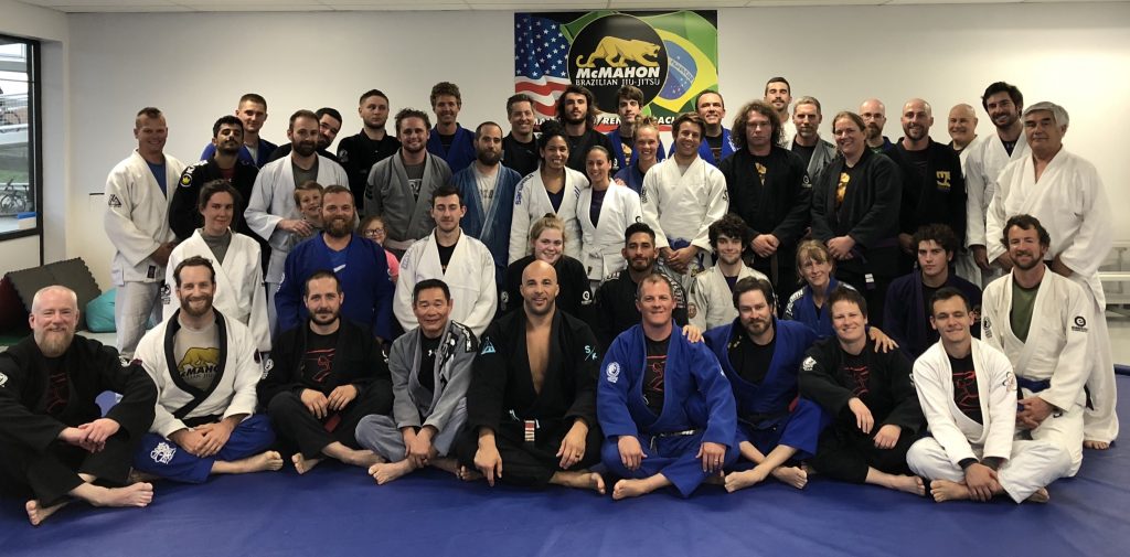 Large group of jiu jitsu students standing for picture