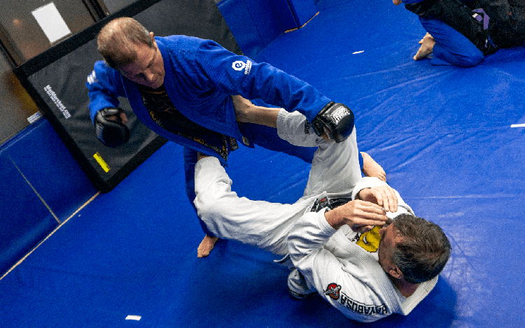 two jiu jitsu black belts practicing self defense 